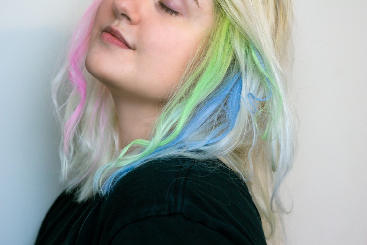 someone with some sidewalk chalk color streaks in their hair