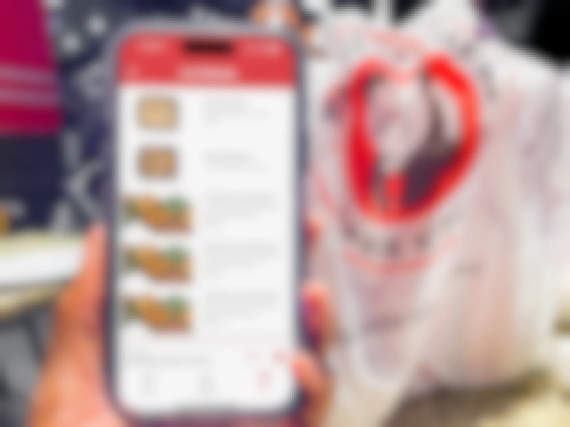 Someone holding a phone displaying the Panda Express app's page for catering