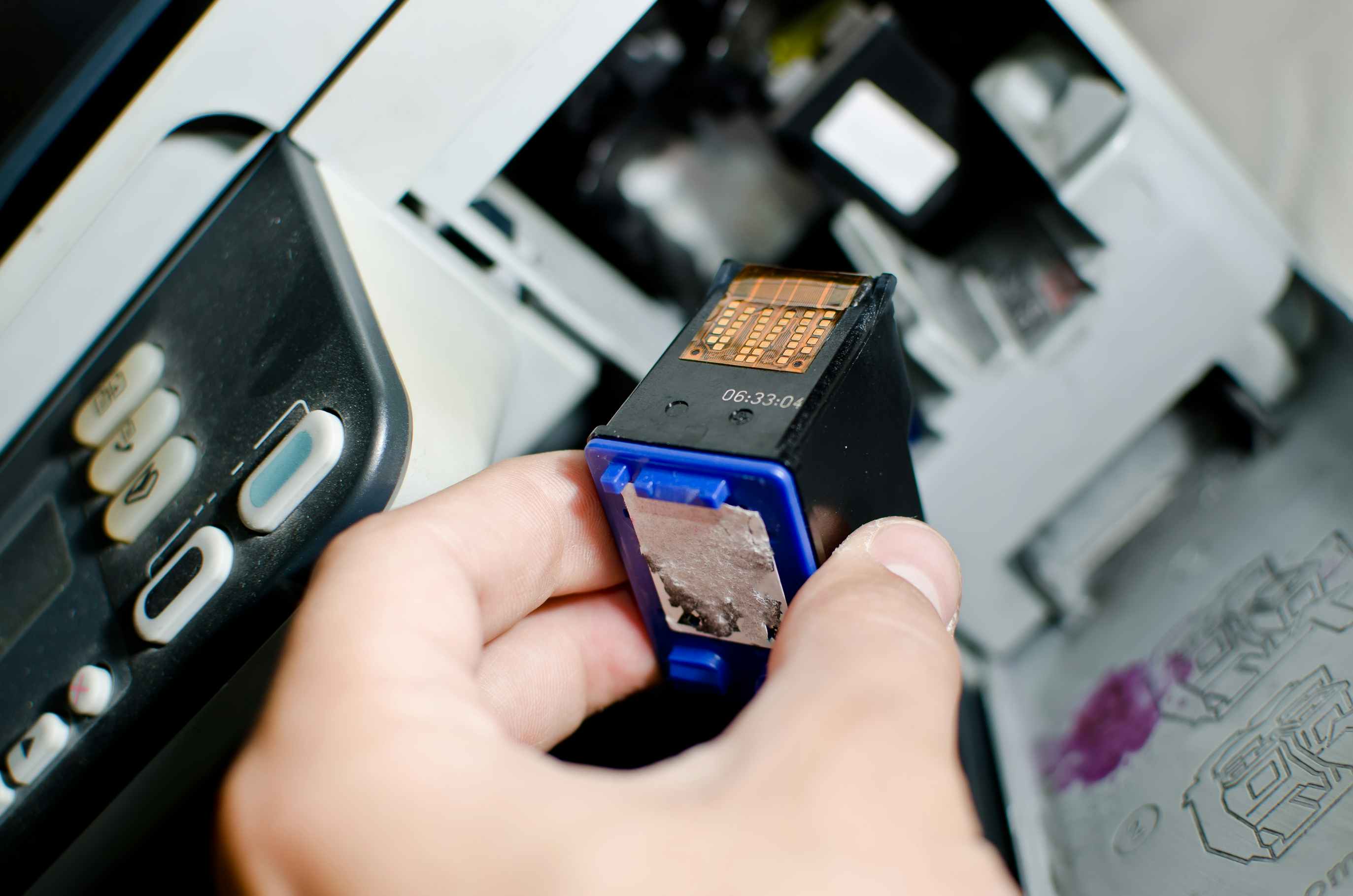 Printer cartridge being removed from a printer