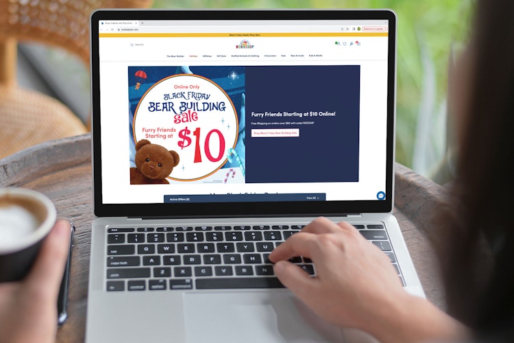 a person looking at the build a bear black friday website on their macbook