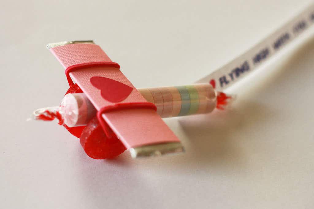 little candy airplane valentine made from stick of gum for wings and smarties for body