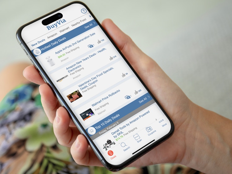 Someone holding a cell phone displaying the BuyVia app