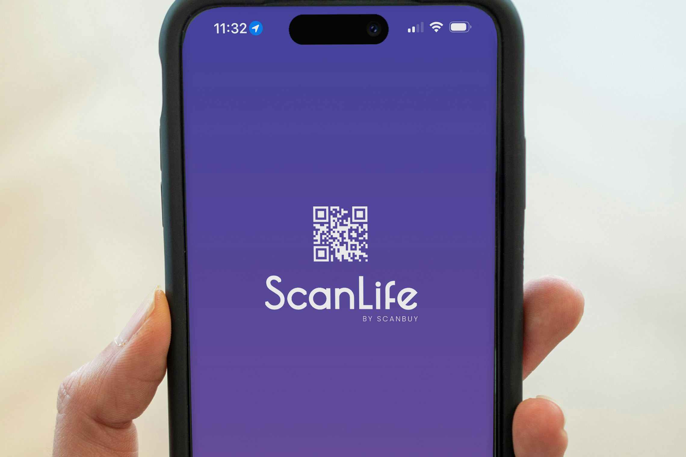 Someone holding up a phone displaying the Scan Life app start screen