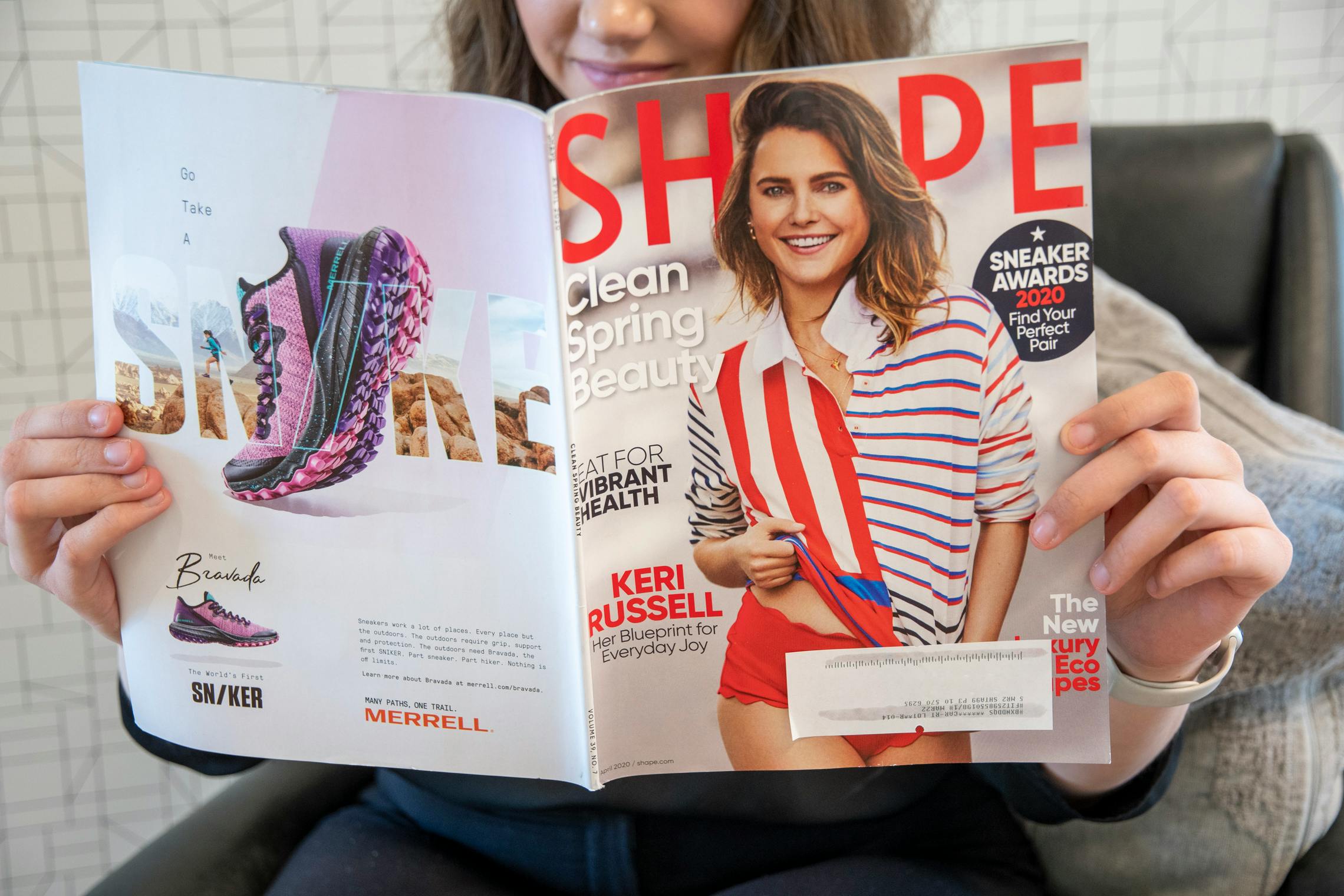 A woman reading shape magazine
