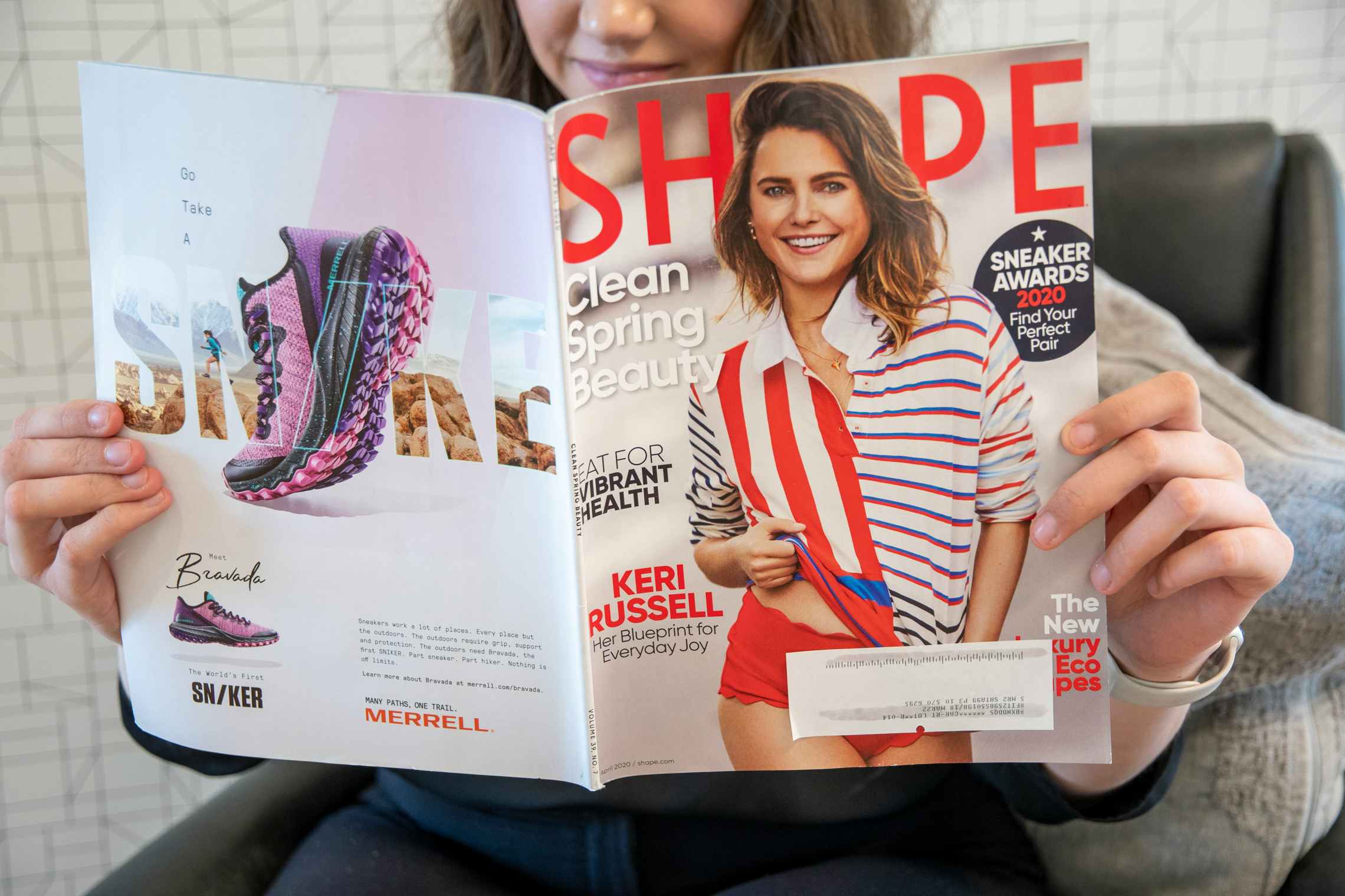 A woman reading shape magazine