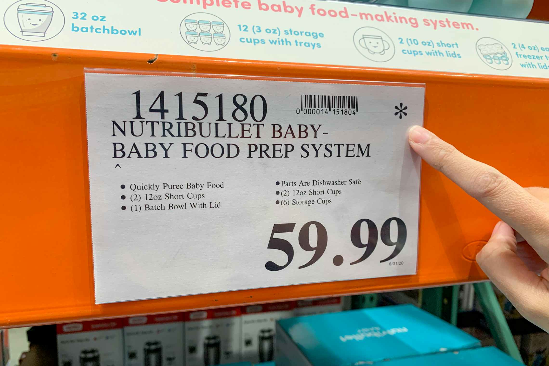 Person pointing out Asterisk on a price tag at Costco