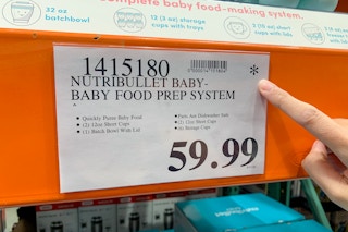 Person pointing out Asterisk on a price tag at Costco