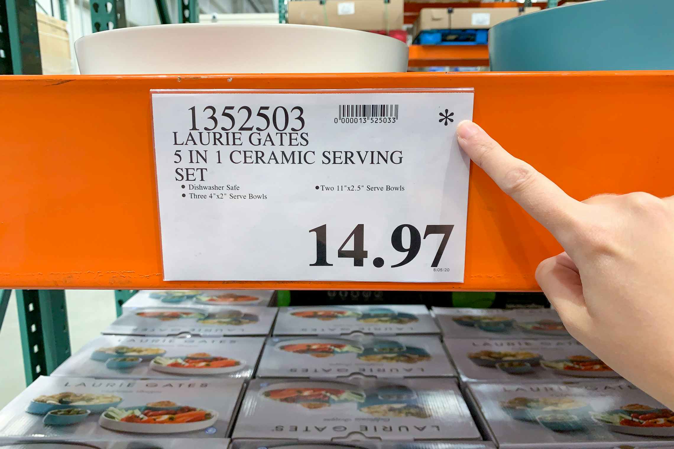 Person pointing out Asterisk on a price tag at Costco