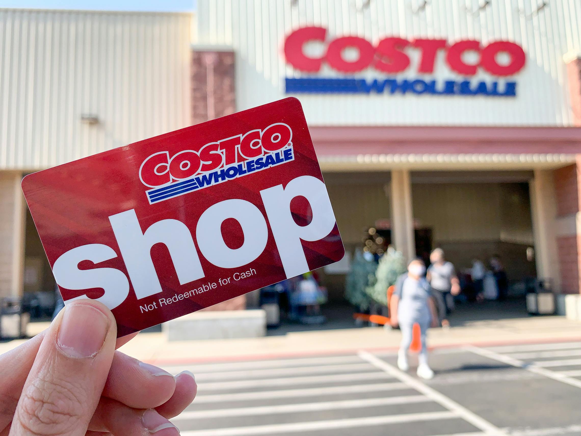 Costco Shop card held in front of Costco.