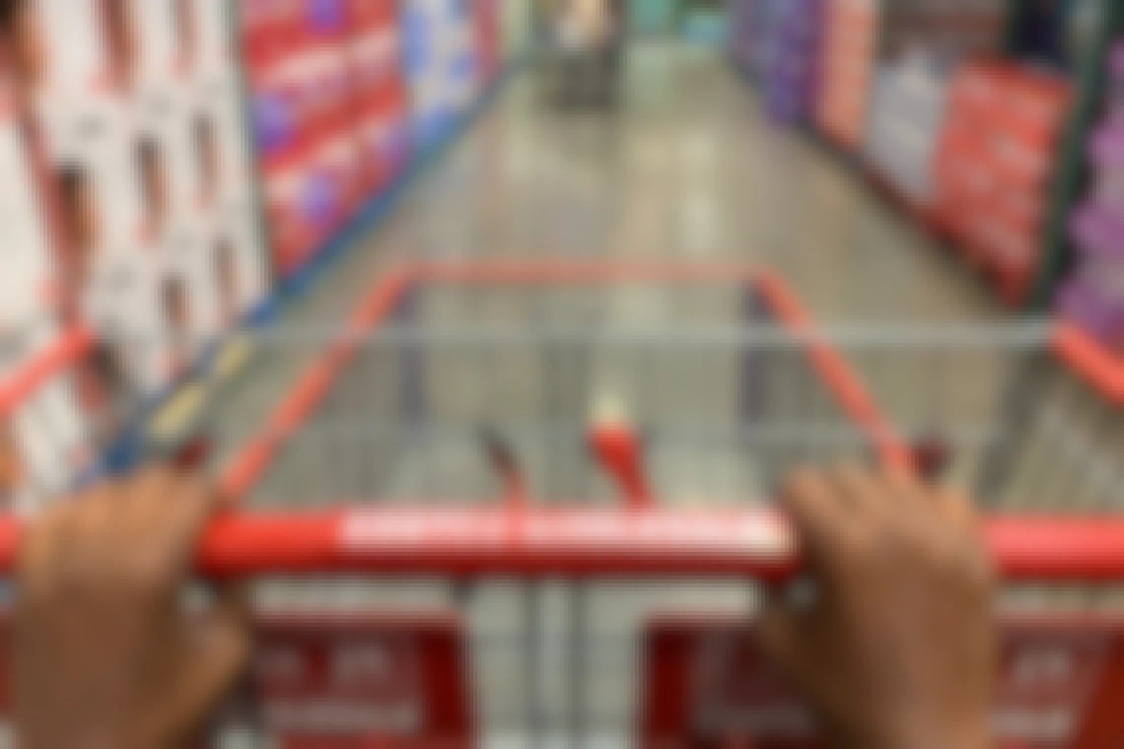 A Costco shopping cart being pushed down an aisle
