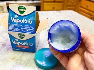 vicks vaporub being held by packaging box
