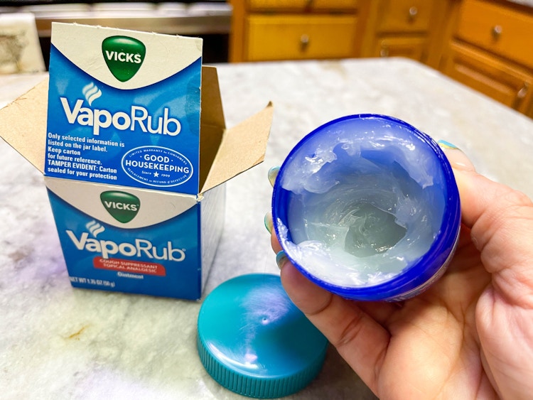 vicks vaporub being held by packaging box