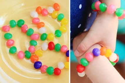 Make bracelets with jelly beans and thread.
