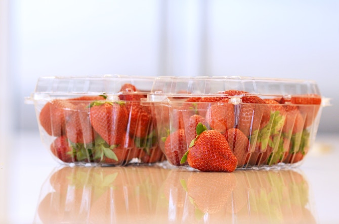 two pints of strawberries in plastic containers