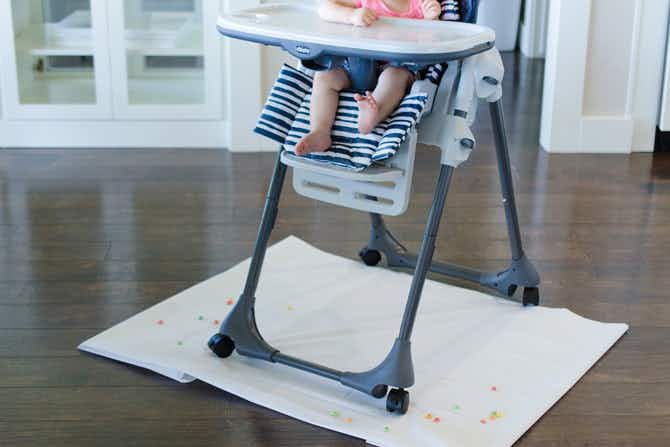 A child sitting in a highchair.