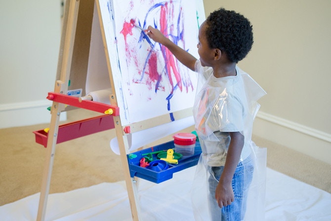 Transform an old shower curtain liner into an art smock.
