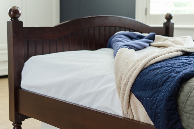 se an old shower curtain liner to accident-proof a bed mattress.