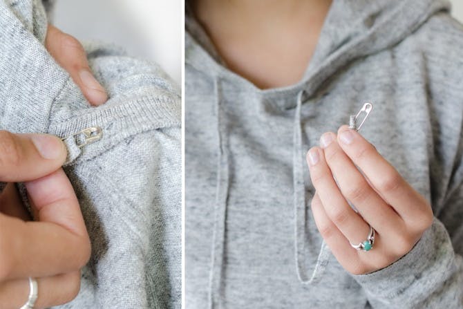 Restring a hoodie by attaching a safety pin to the end and using it as a guide.