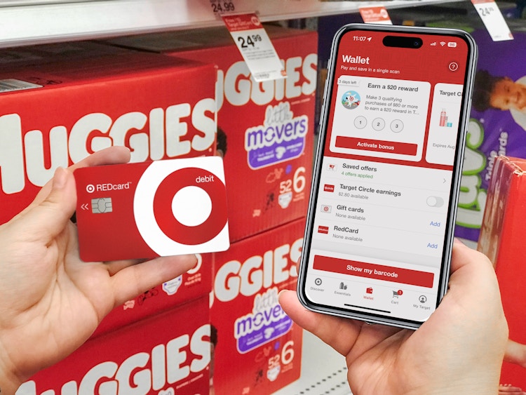 someone holding up their Target RedCard next to a phone displaying the Target app