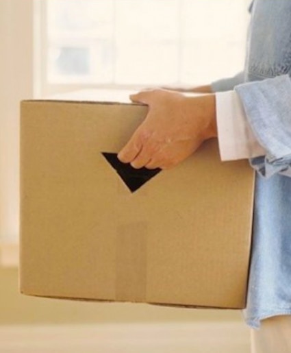 cut hand holes in boxes for easy moving