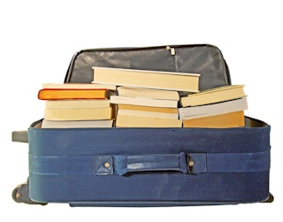 save money on moving boxes by using luggage