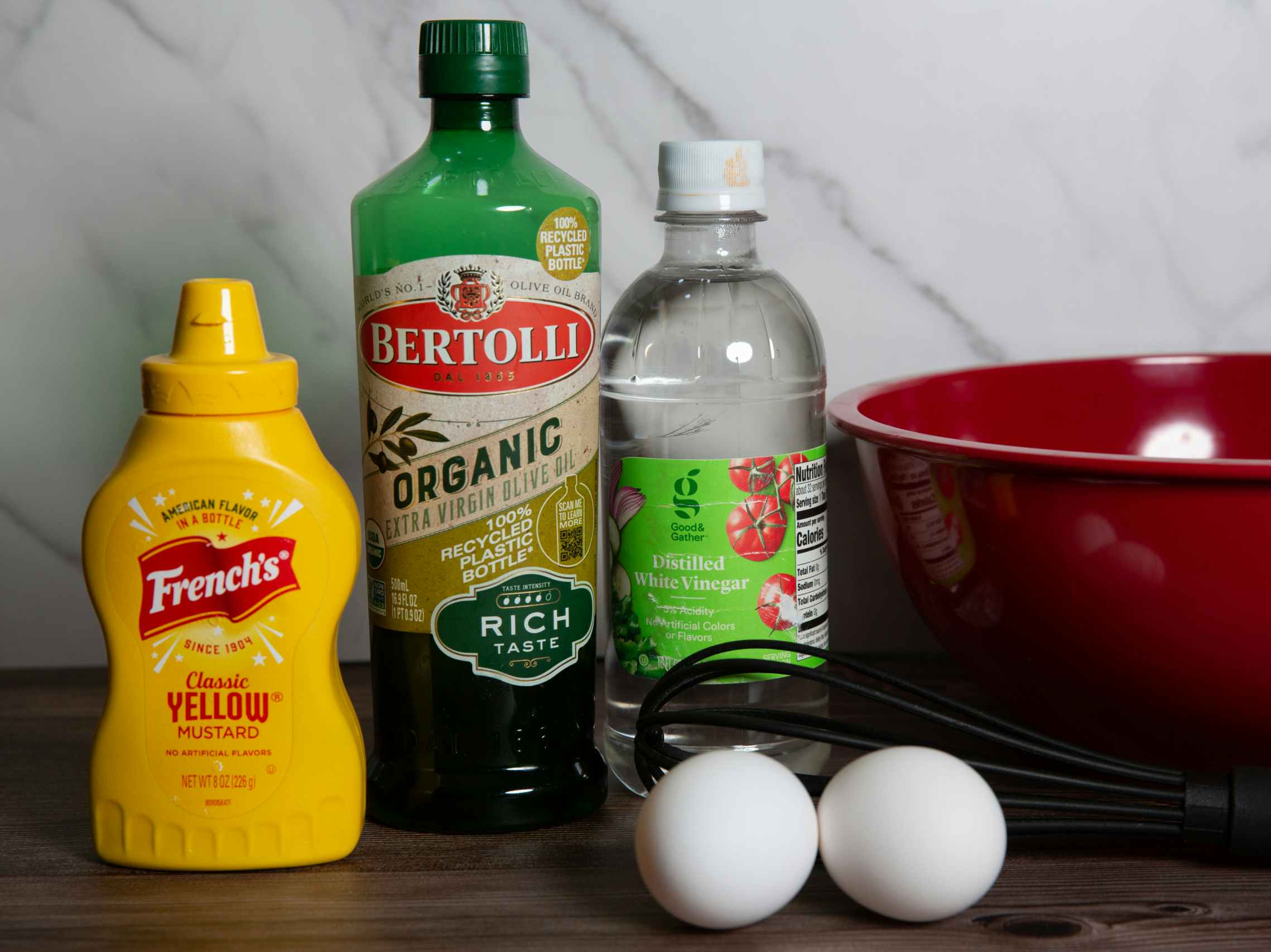 Ingredients to make mayo at home; mustard, oil, vinegar, two eggs