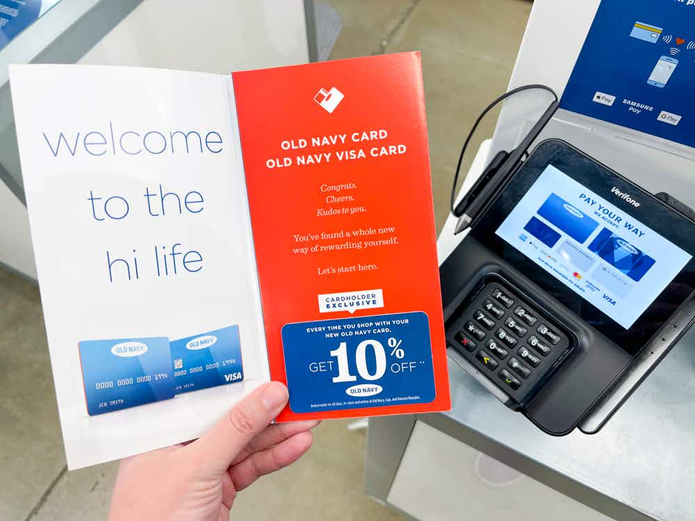 Old Navy credit card pamphlet held at checkout.