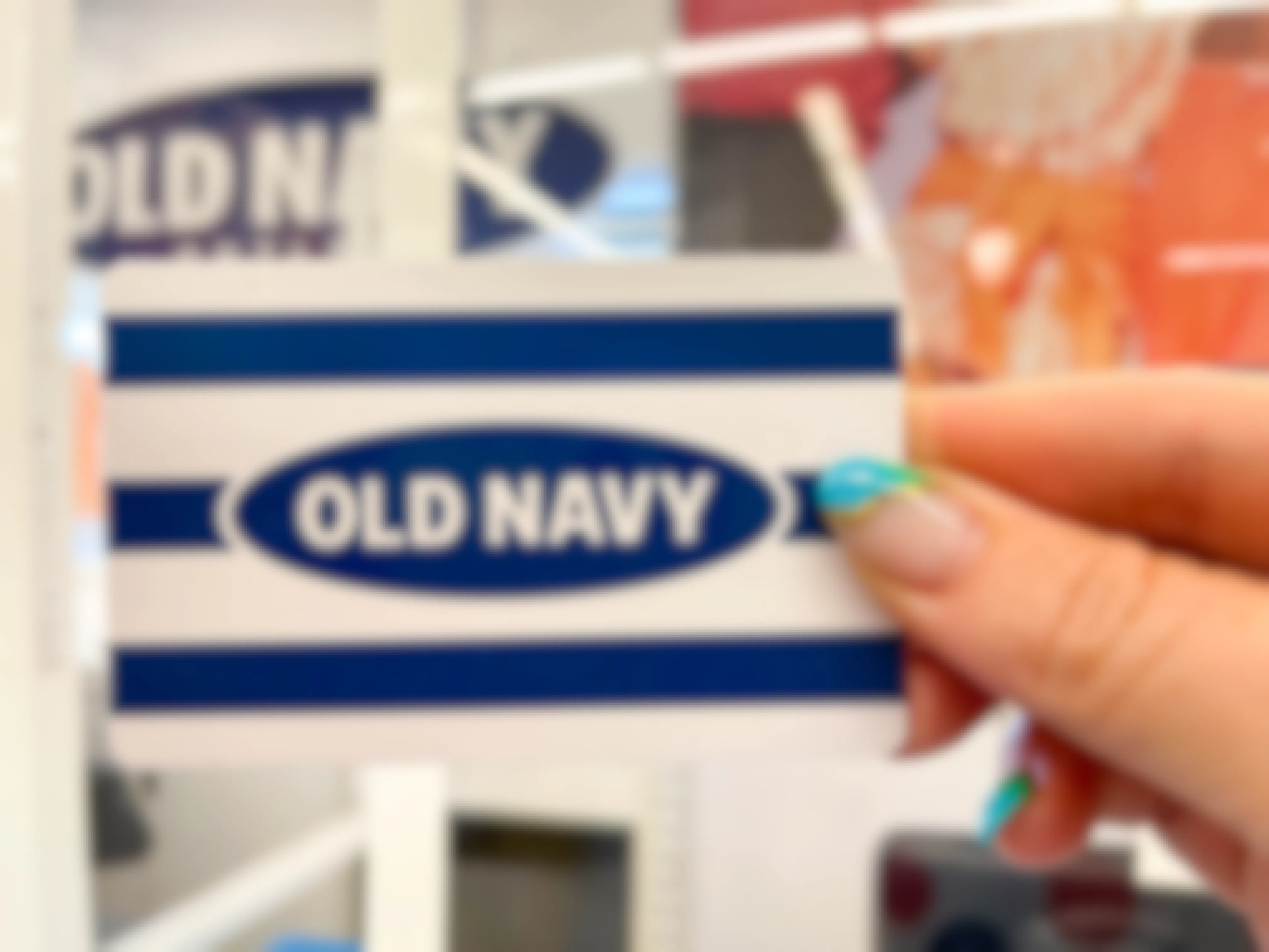 hand holding old navy gift card