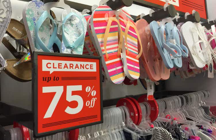 A wall of flip-flops on display at Old Navy with a sign that reads "Clearance, up to 75% off