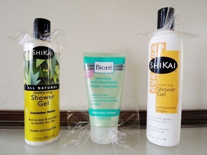 Use plastic wrap under caps of opened bottles
