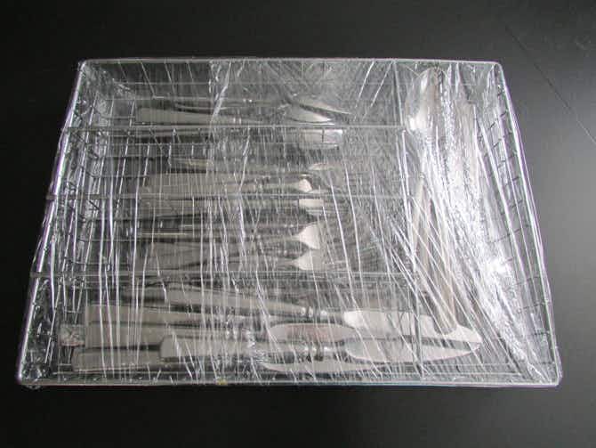 Wrap silverware in the tray with plastic wrap
