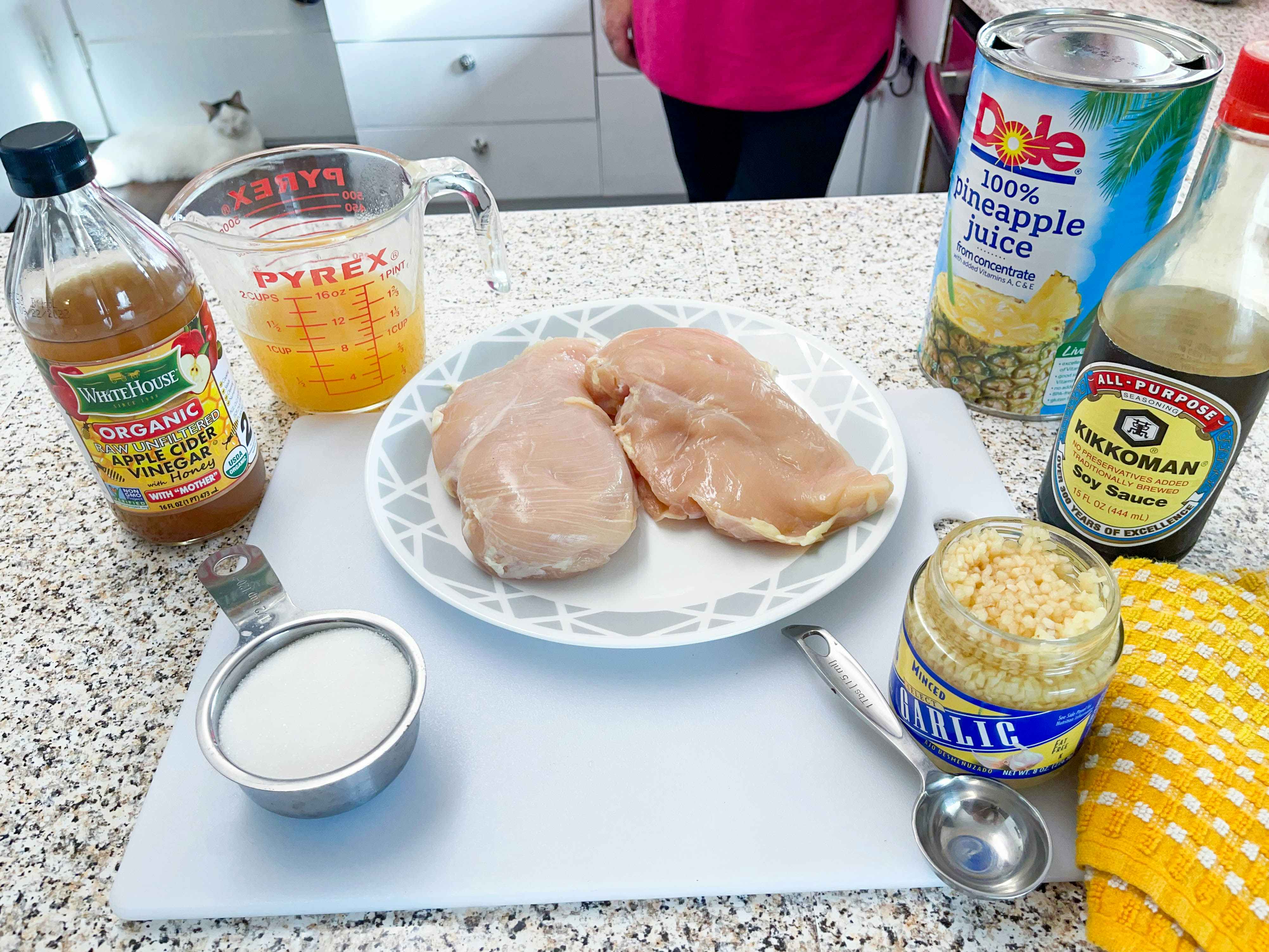 woman preparing ingredients to make a freezer meals 