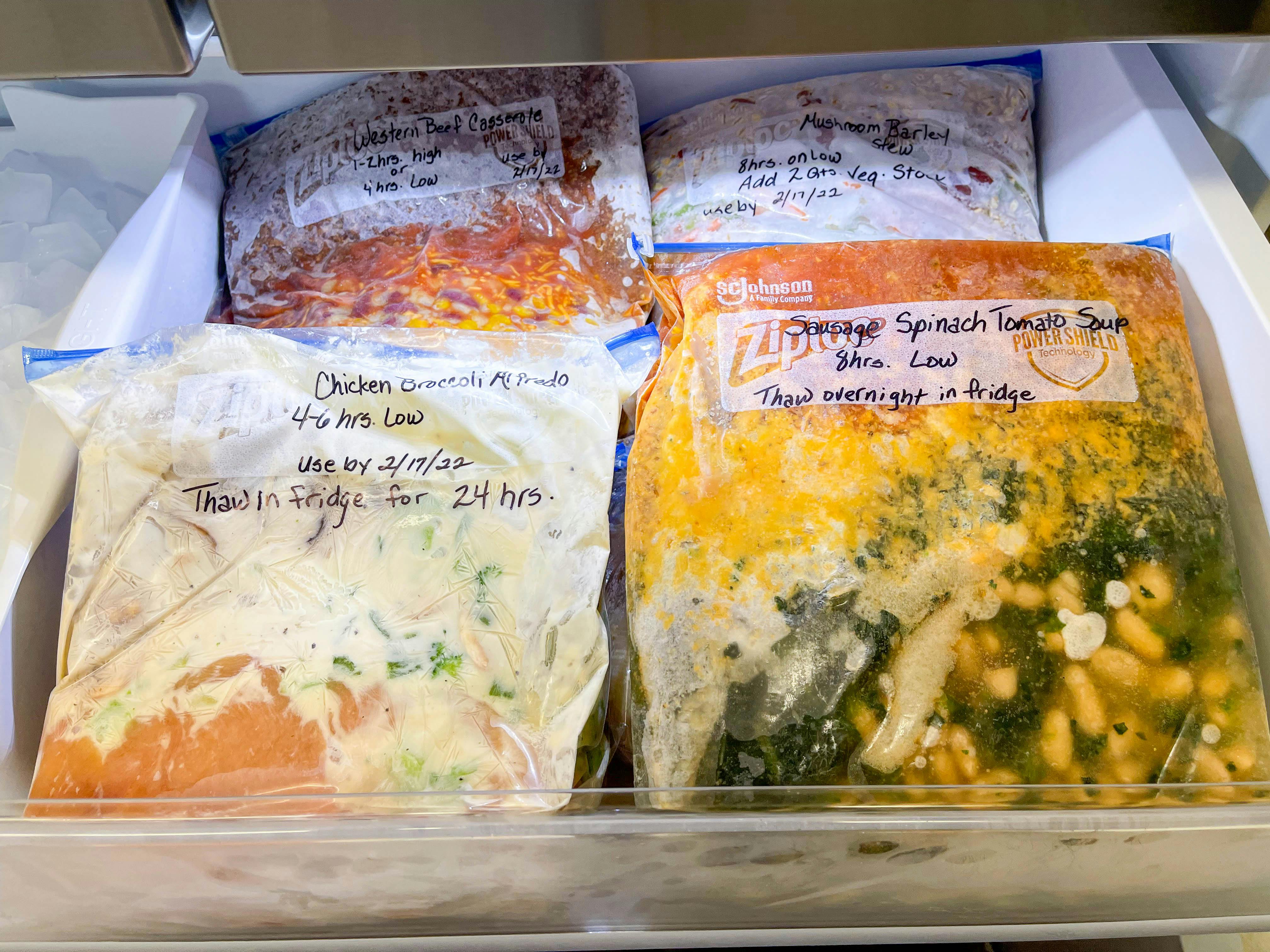 freezer meals in ziploc bags in a freezer