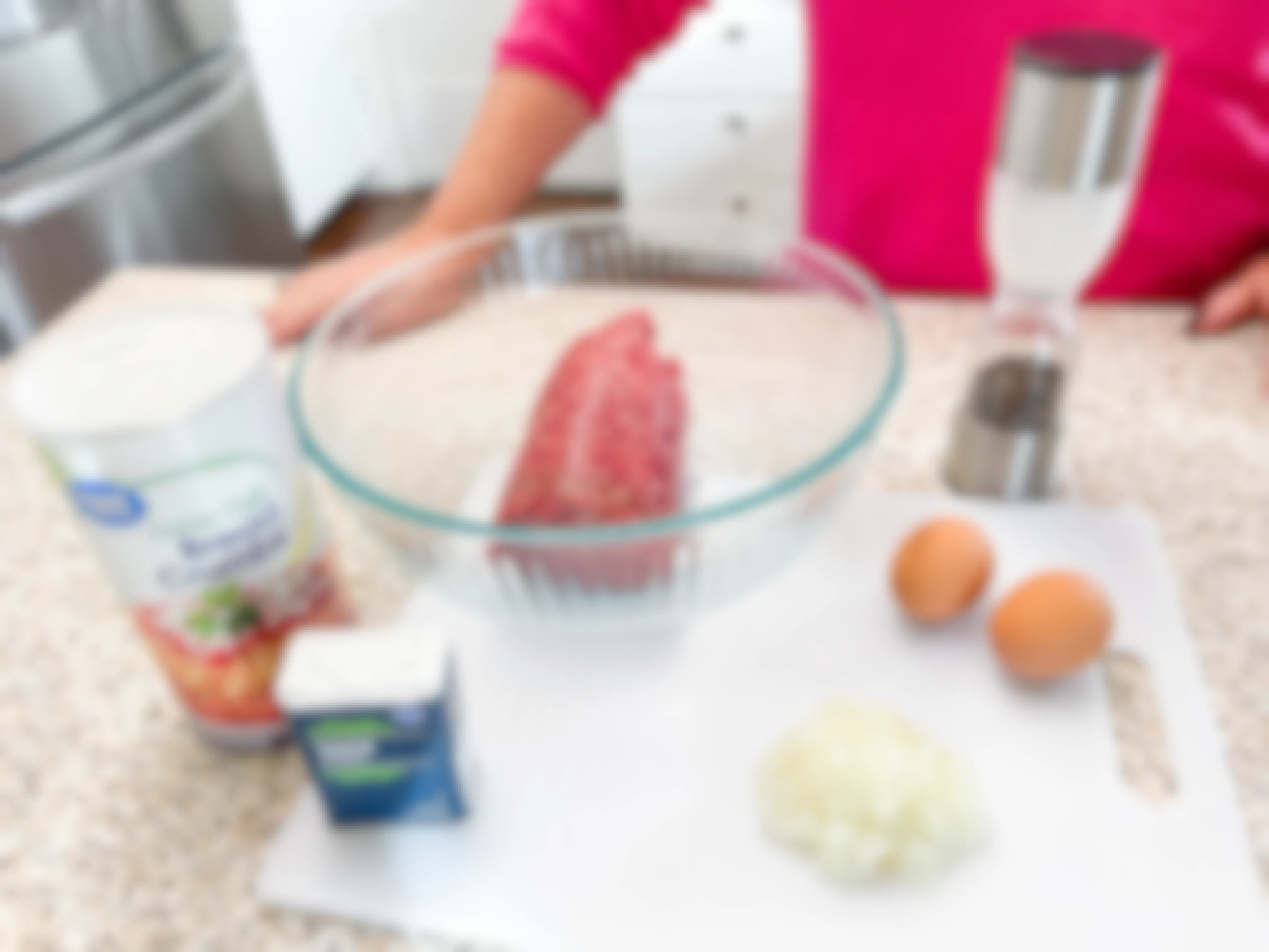 woman preparing ingredients for a meat loaf 
