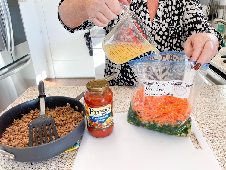 woman putting ingredients in a ziplog bag