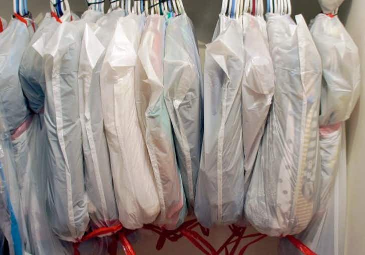 use a trash bag to move hanging clothes easier