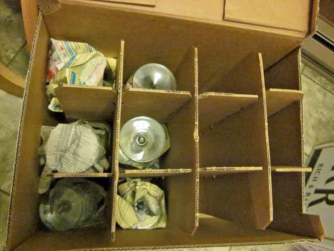 Use wine boxes to pack wine glasses