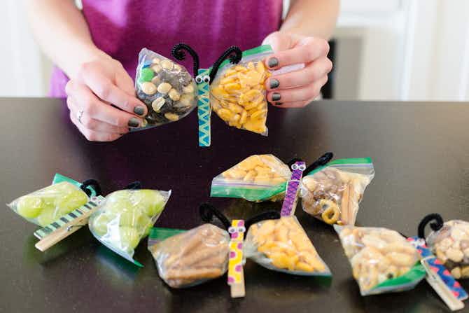 Ziplock bags, with snacks in them, twisted and clipped with a decorated clothes pin to make butterfly snacks. 