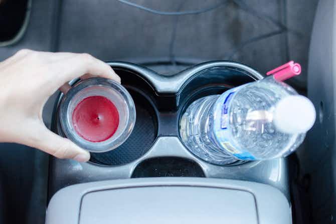 Freshen the air in your car with leftover candle wax in a glass candle holder.