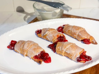 cherry filled crecent rolls on a platter