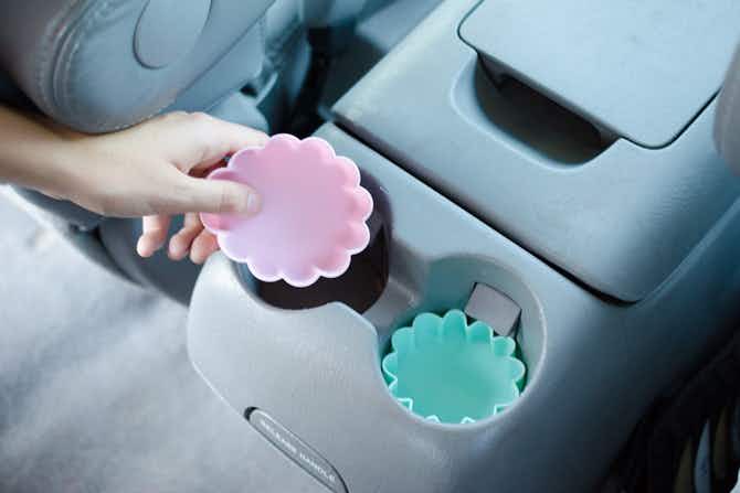 Catch cup-holder crumbs and spills with silicone cupcake liners.