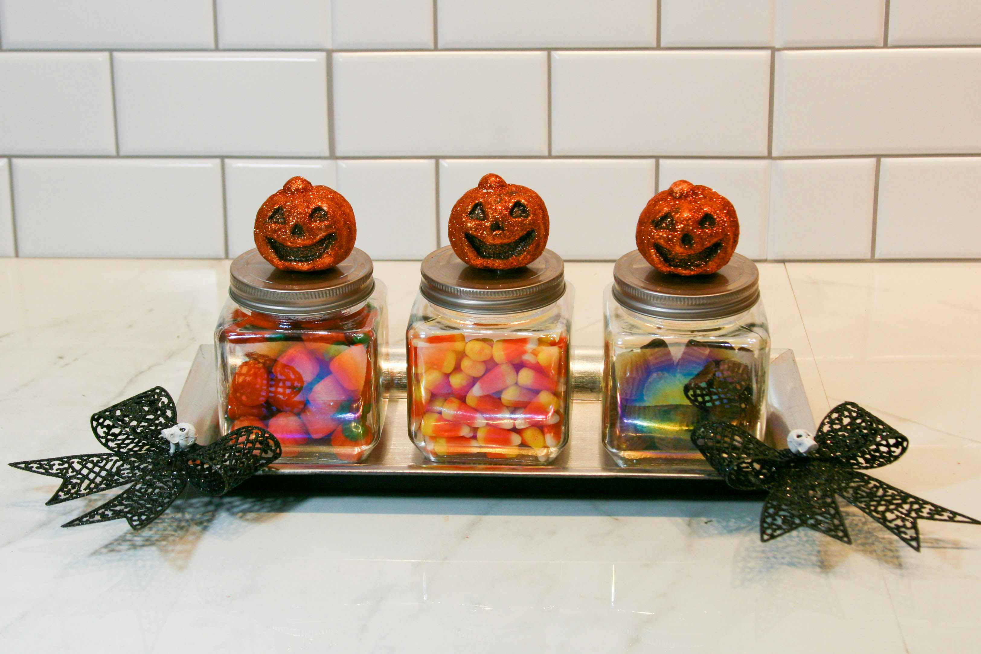 A diy tri of glass candy jars for halloween