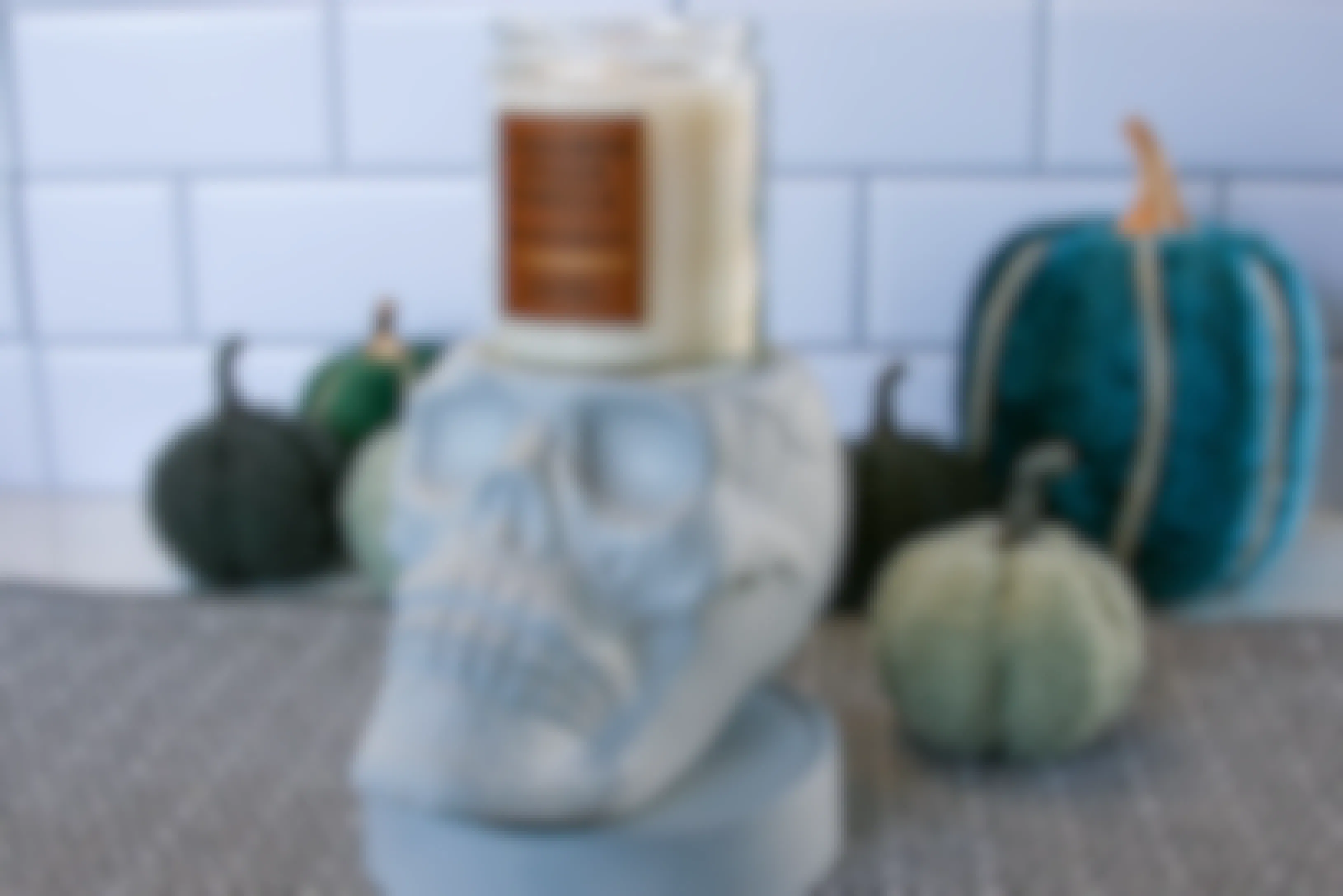 a homemade skull candle holder sitting on a counter with a candle on top