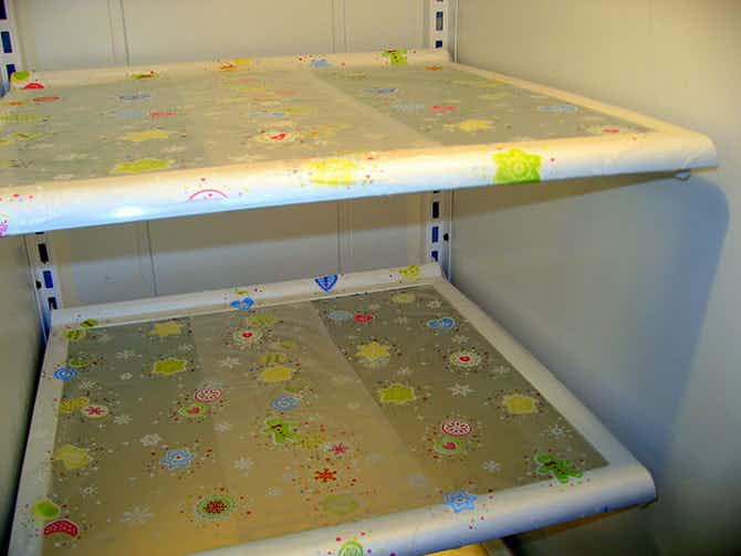 Fridge & Freezer Hack: Cover your refrigerator shelves with plastic wrap for easy spill cleanup.