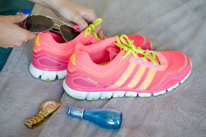 Someone placing sunglasses in shoes