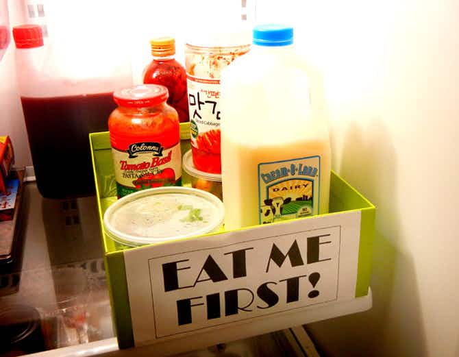 Fridge & Freezer Hack: Reduce waste by putting expiring food in an "Eat Me First" box.