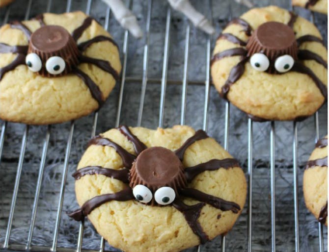 Cookies baked with peanut butter cups and chocolate to make them look like spiders.