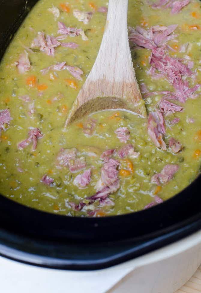 A crockpot split pea soup with chunks of ham 