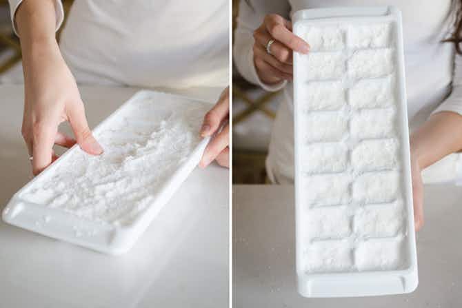 a person firmly packed dishwashing detergent into ice cube trays 