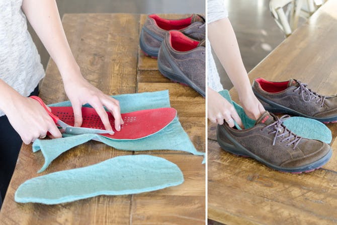 A person cutting wool in the shape of a shoe insole and putting it inside a shoe